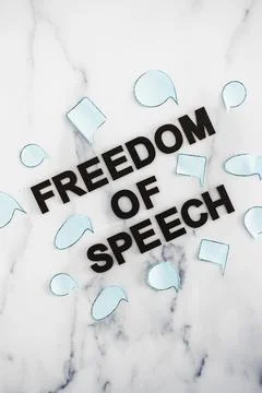 Freedom of speech text surrounded by group of different comic bubbles represe Stock Photos