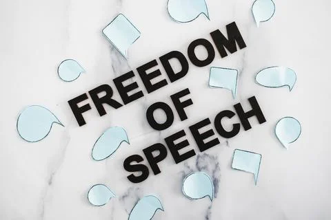 Freedom of speech text surrounded by group of different comic bubbles represe Stock Photos