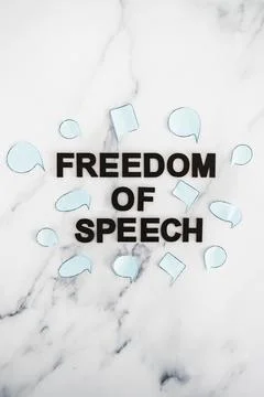 Freedom of speech text surrounded by group of different comic bubbles represe Stock Photos