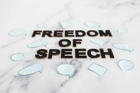 Freedom of speech text surrounded by group of different comic bubbles represe Stock Photos
