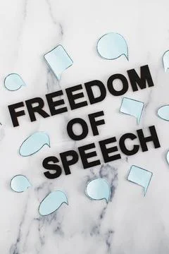 Freedom of speech text surrounded by group of different comic bubbles represe Stock Photos
