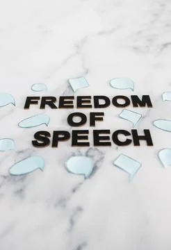 Freedom of speech text surrounded by group of different comic bubbles represe Stock Photos