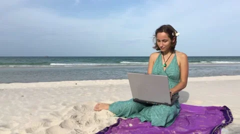 Freelance, beach, work, laptop: young woman typing, thinking (tripod) Video stock 65146164