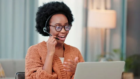 A freelance call center agent consulting a client while working from home. Happy Stock Footage 201906745