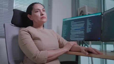 Freelance coding, discouraged, tired of computer technology work, she is thinkin Stock Footage 270288377