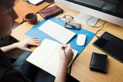 Freelance developer and designer working at home, man writing in Stock Photos