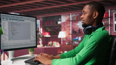 Freelance developer writing code in a modern programming language Stock Footage 307724816