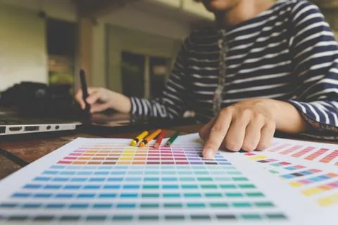 Freelance graphic designer using digital tablet, computer, woman working wi.. Stock Photos