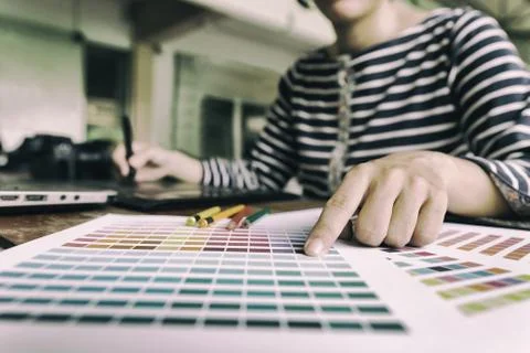Freelance graphic designer using digital tablet, computer, woman working wi.. Stock Photos
