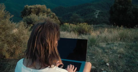 Freelance man programmer using laptop computer outdoor on mountain travel Stock Footage 202639184