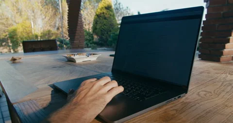 Freelance man work with laptop computer and drink coffee or tea in terrace Stock Footage 208670162