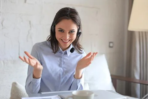 Freelance operator talking with headsets and consulting clients. Stock Photos