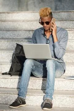 Freelance programmer calling to client Stock Photos