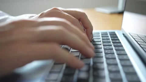 Freelance Programmer Typing Fast on Laptop at Home Desk Stock-Footage 330174785