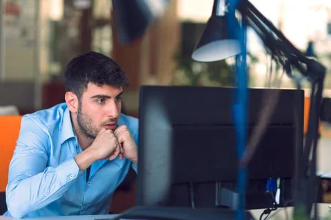 Freelance programmer working in startup office Stock-Fotos