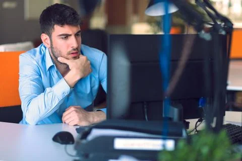 Freelance programmer working in startup office Stock Photos