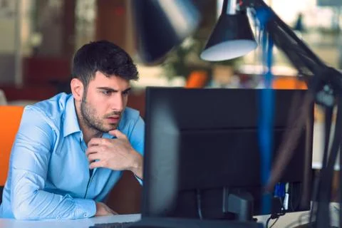 Freelance programmer working in startup office Stock Photos