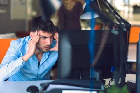 Freelance programmer working in startup office Stock Photos