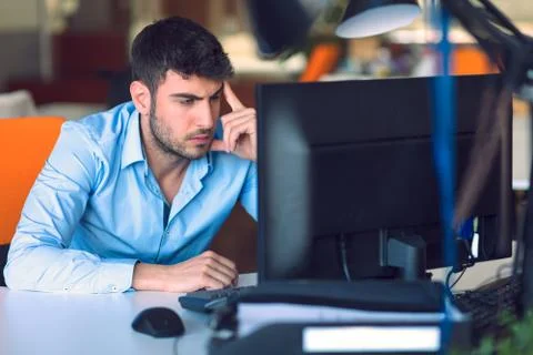 Freelance programmer working in startup office Stock Photos