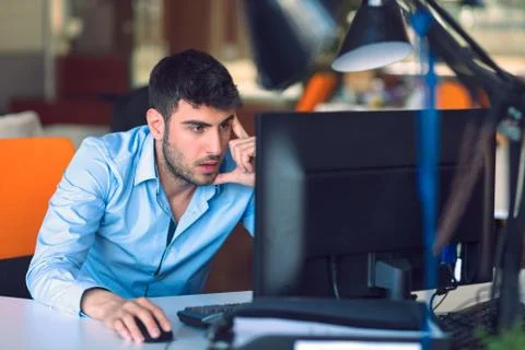 Freelance programmer working in startup office Stock Photos