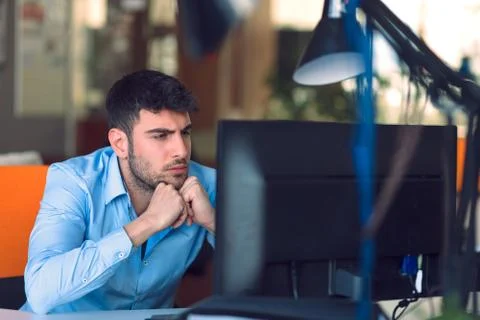 Freelance programmer working in startup office Stock Photos