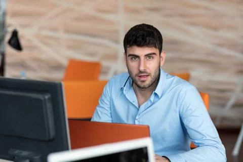 Freelance programmer working in startup office Stock Photos