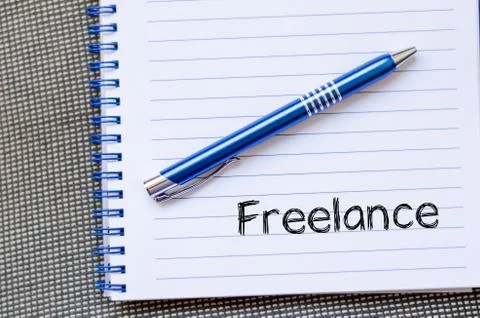 Freelance text concept on notebook Stock Photos