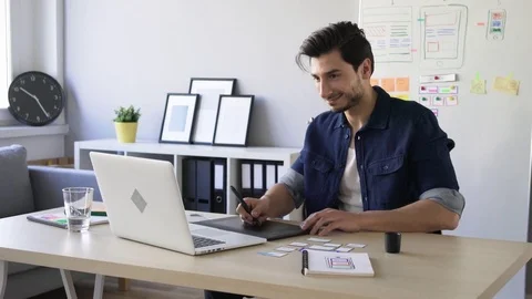 Freelance web designer working on new project with tablet Stock Footage 72874254