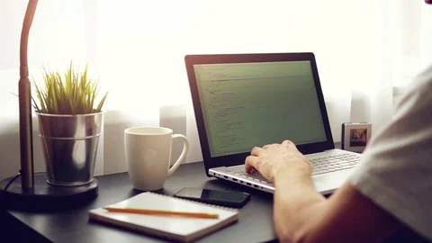 Freelance website programmer working on laptop Stock Footage 69822899