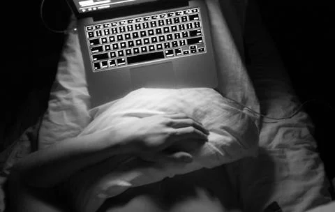 Freelance worker in the bed Stock Photos