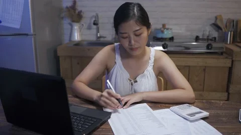 Freelance worker is continuing her paperwork Video stock 155295224
