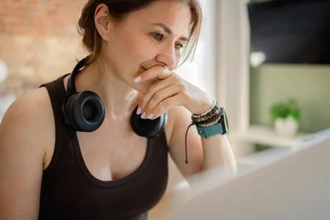 Freelance worker using laptop during morning in home office Stock Photos