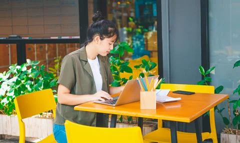 Freelance worker working on documents with graphs. and information about fi.. Stock Photos