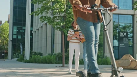 Freelance workers standing outside office center discussing details of project Stock Footage 316465821