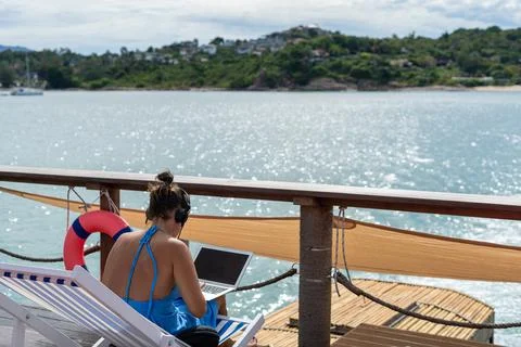 Freelance workers work with laptops on board with 5G internet connection. Fre Stock Photos