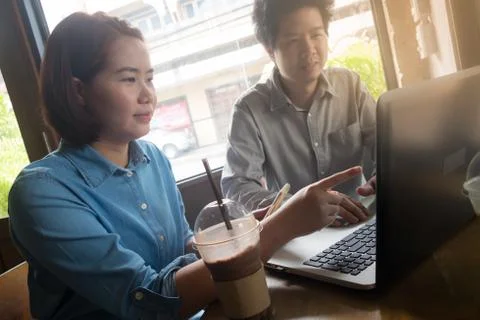 Freelance workers working together in cafe Stock Photos