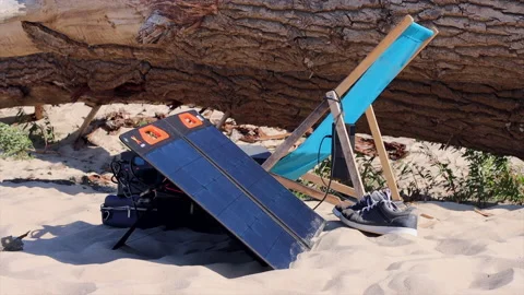 Freelancer and digital nomad working place concept. Sun bed close to solar panel Stock Footage 208900661