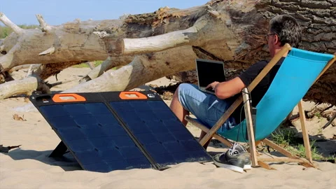 Freelancer and digital nomad working place concept. Sun bed close to solar panel Stock Footage 208909463