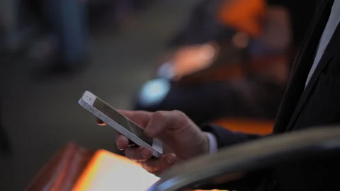 Freelancer answer text message or work email in smartphone typing it while Video stock 133595409