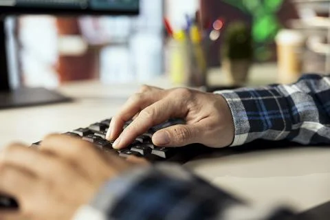 Freelancer in apartment using PC to complete spreadsheets, solving tasks Stock Photos