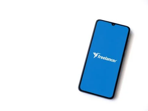 Freelancer app launch screen with logo on the display of a black mobile smart Stock Photos