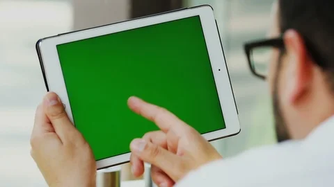 Freelancer arms using digital tablet with chromakey screen Stock Footage 112990485