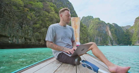 Freelancer with artificial bionic leg remote working to office on vacation. Stock Footage 201366713