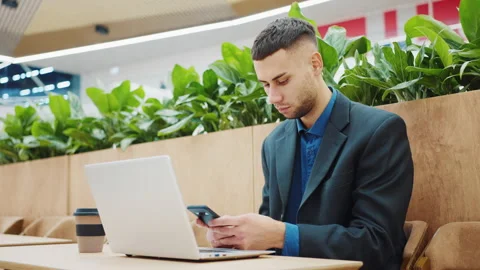Freelancer in cafe texting message on phone Stock Footage 172197777