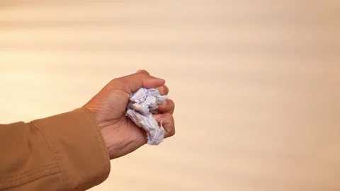 A freelancer clenches a handful of crumpled client documents. Video stock 317599491