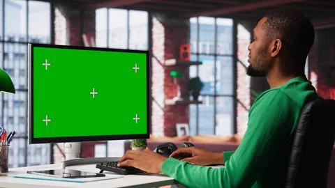 Freelancer completing spreadsheets on isolated chroma key on pc Stock Photos