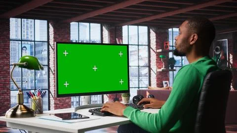 Freelancer completing spreadsheets on isolated chroma key on pc Stock Photos