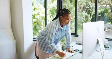 Freelancer, computer and notebook with black woman in home office for web d.. 写真素材