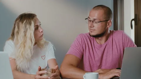 Freelancer Couple  Working Together in cafe, having a coffee break Stock Footage 132808171