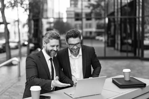 Freelancer developer do business online outdoor. Excited businessmen. Freelance Stock Photos